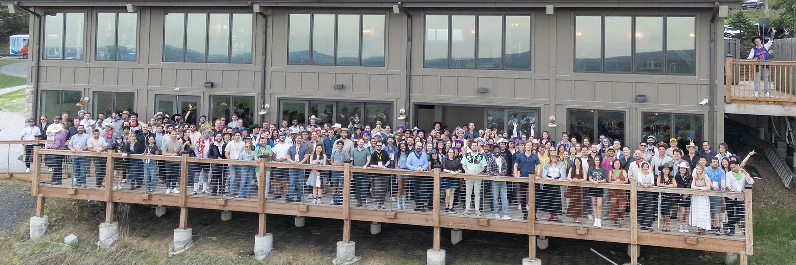The Alloy team gathered together on a deck at a company offsite