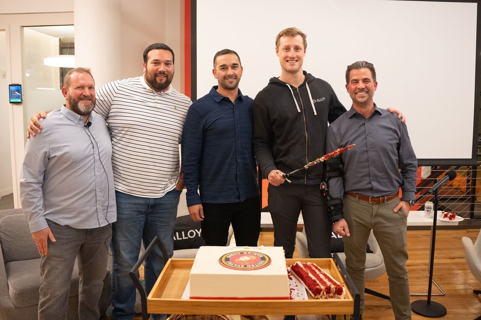 A group of Alloy leaders standing together in the office